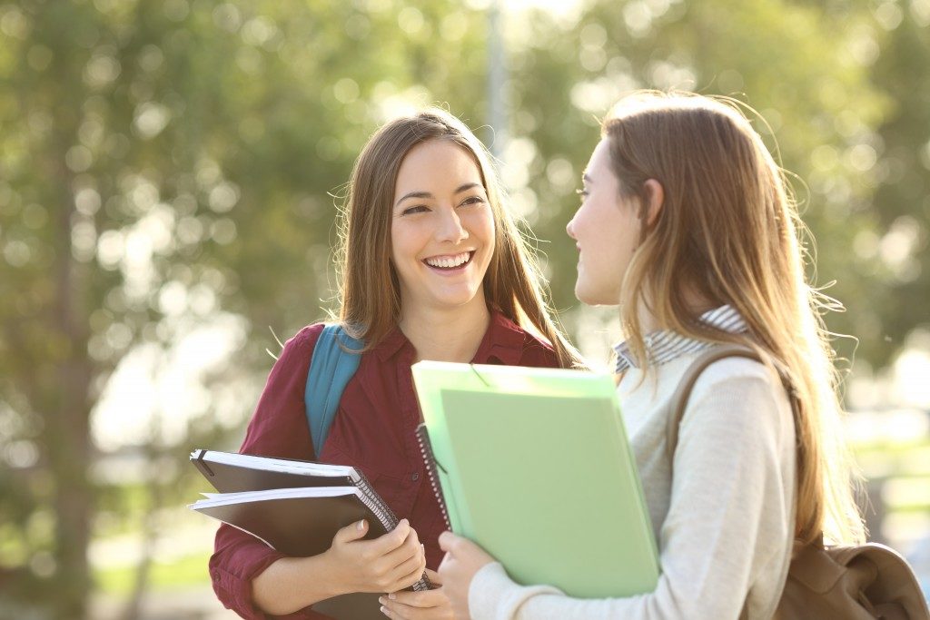 grad students talking in the campus