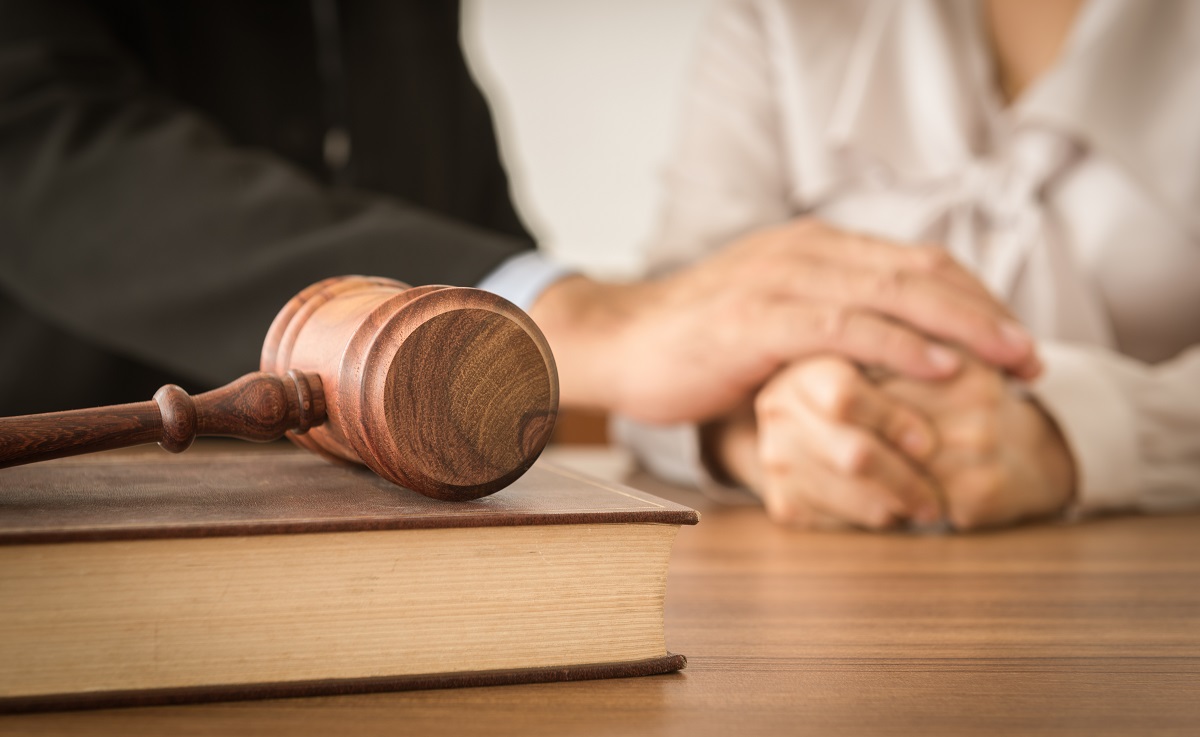 attorney comforting a woman