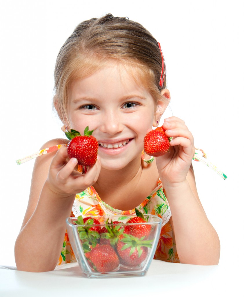 kid holding strawberry