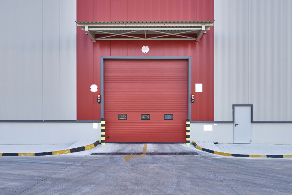 a portait of the exterior of a warehouse shutter door