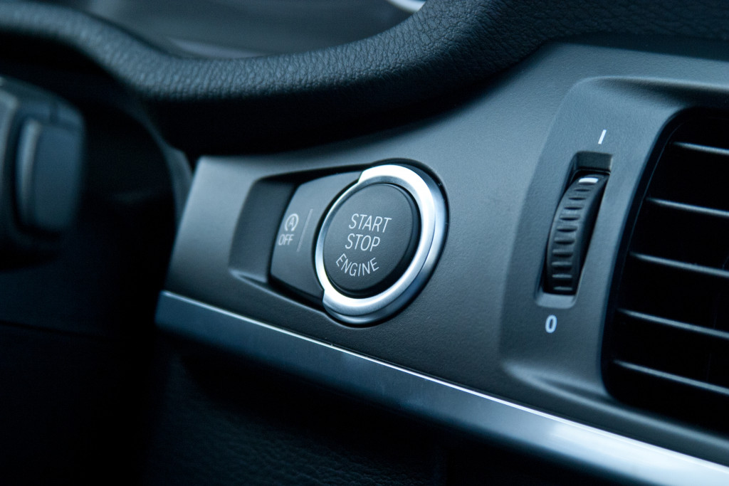 Car interior view with a push start button 