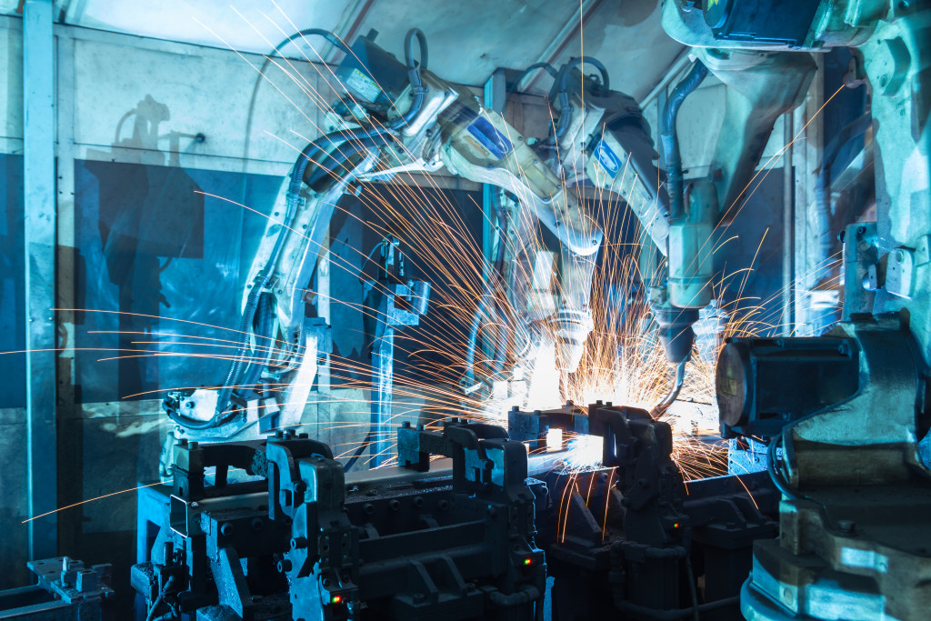 Welding robots working on the production of automobile parts in a factory.