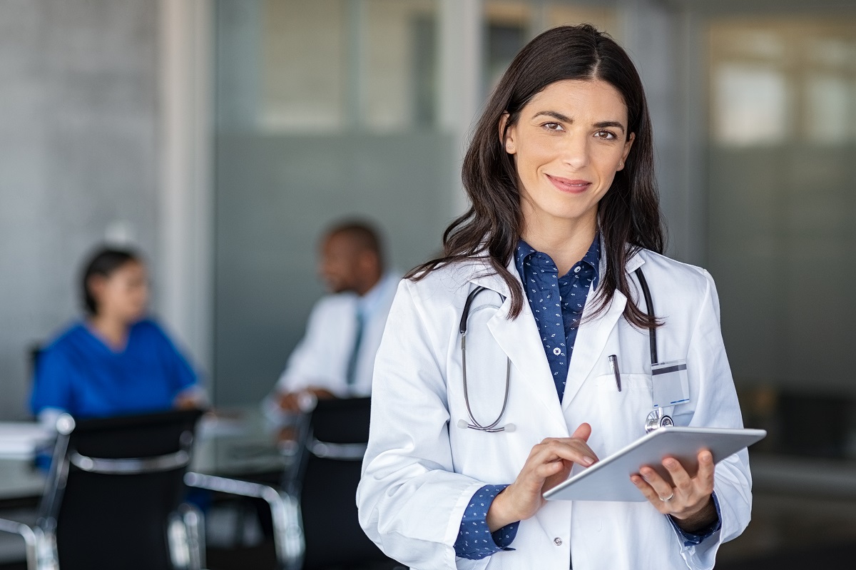 female doctor using digital tablet