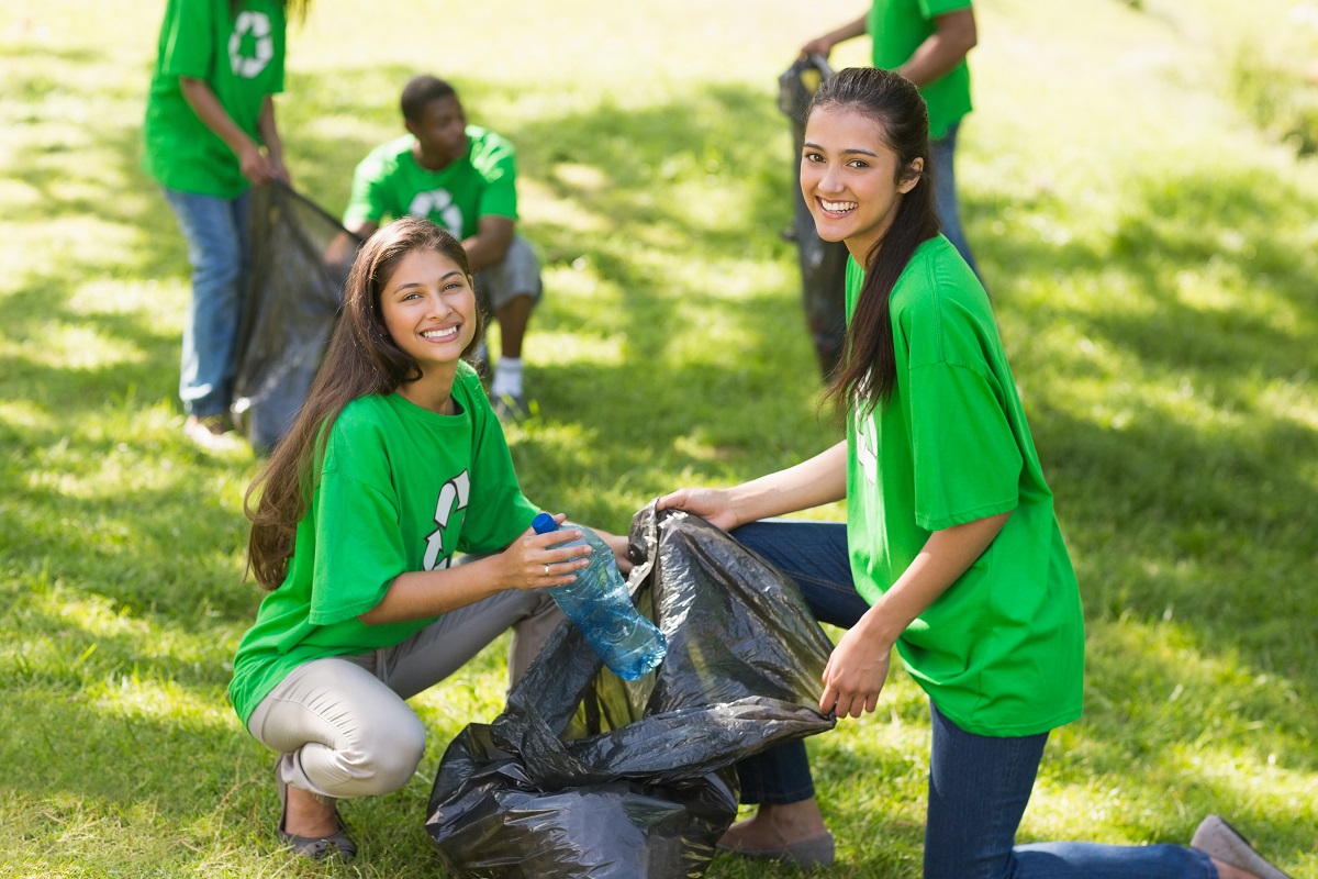 Community helping clean up an outdoor area.