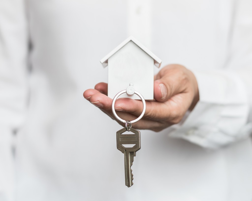 holding keys to house
