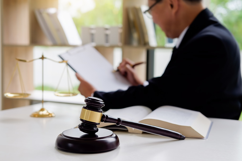 a lawyer reading a document in his office