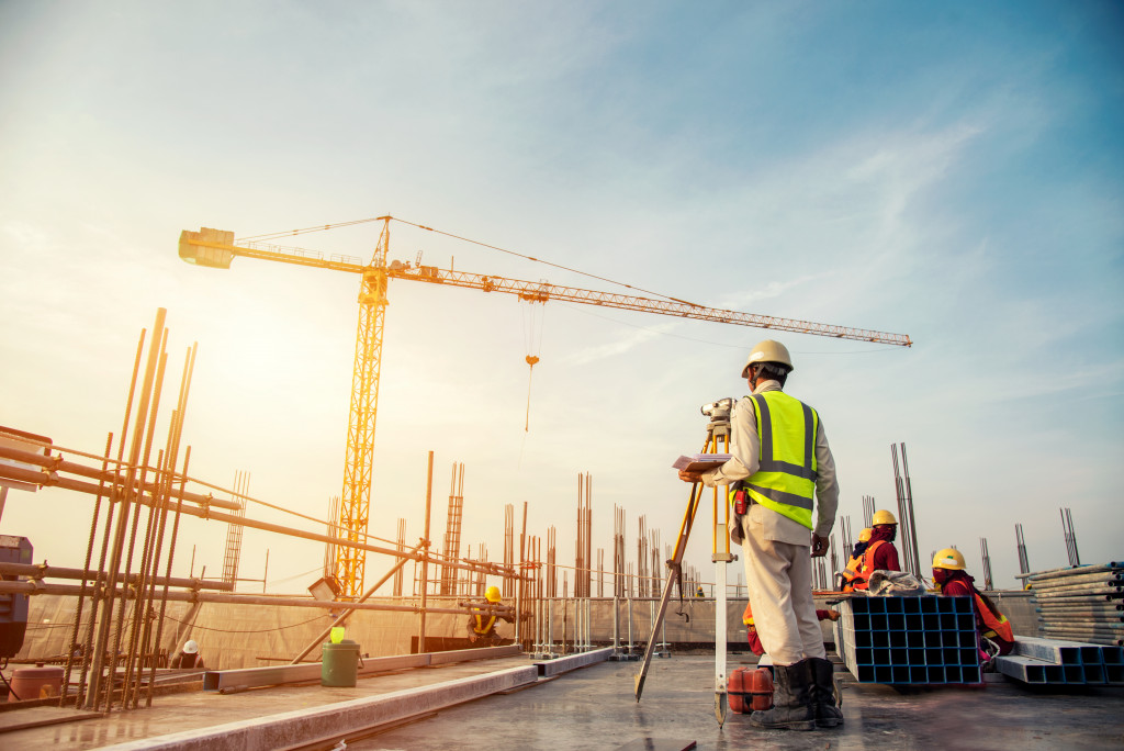Construction workers wearing proper safety gear at a construction site.