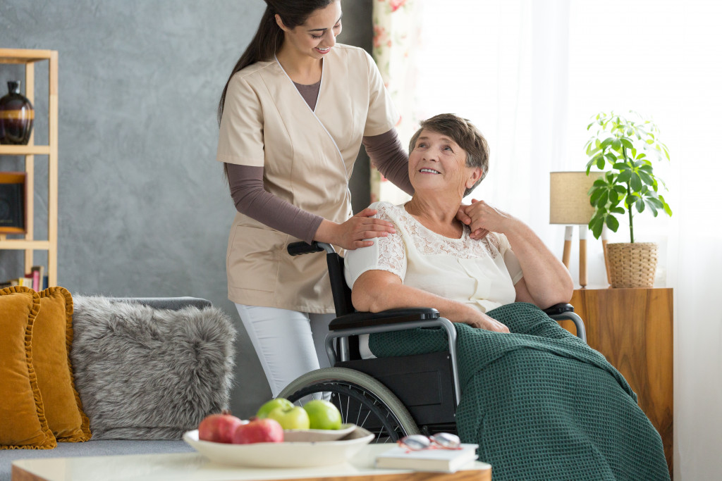 hospice care nurse with a patient in wheelchair