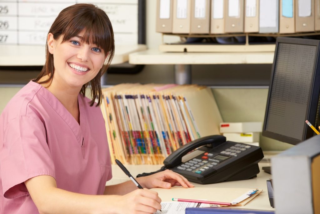 hospital nurse checking patients' records