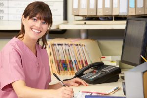 hospital nurse checking patients' records