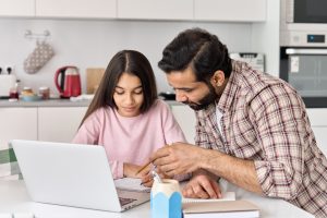 dad teaching daughter
