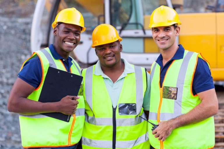 manager with workers at the construction site