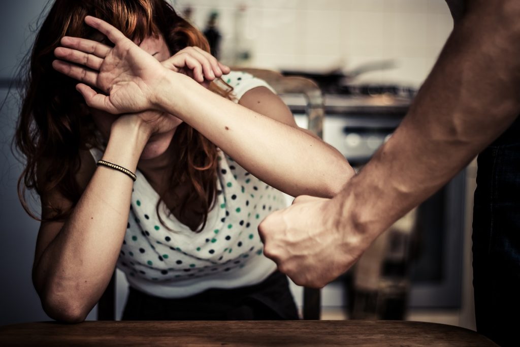 woman covering her face