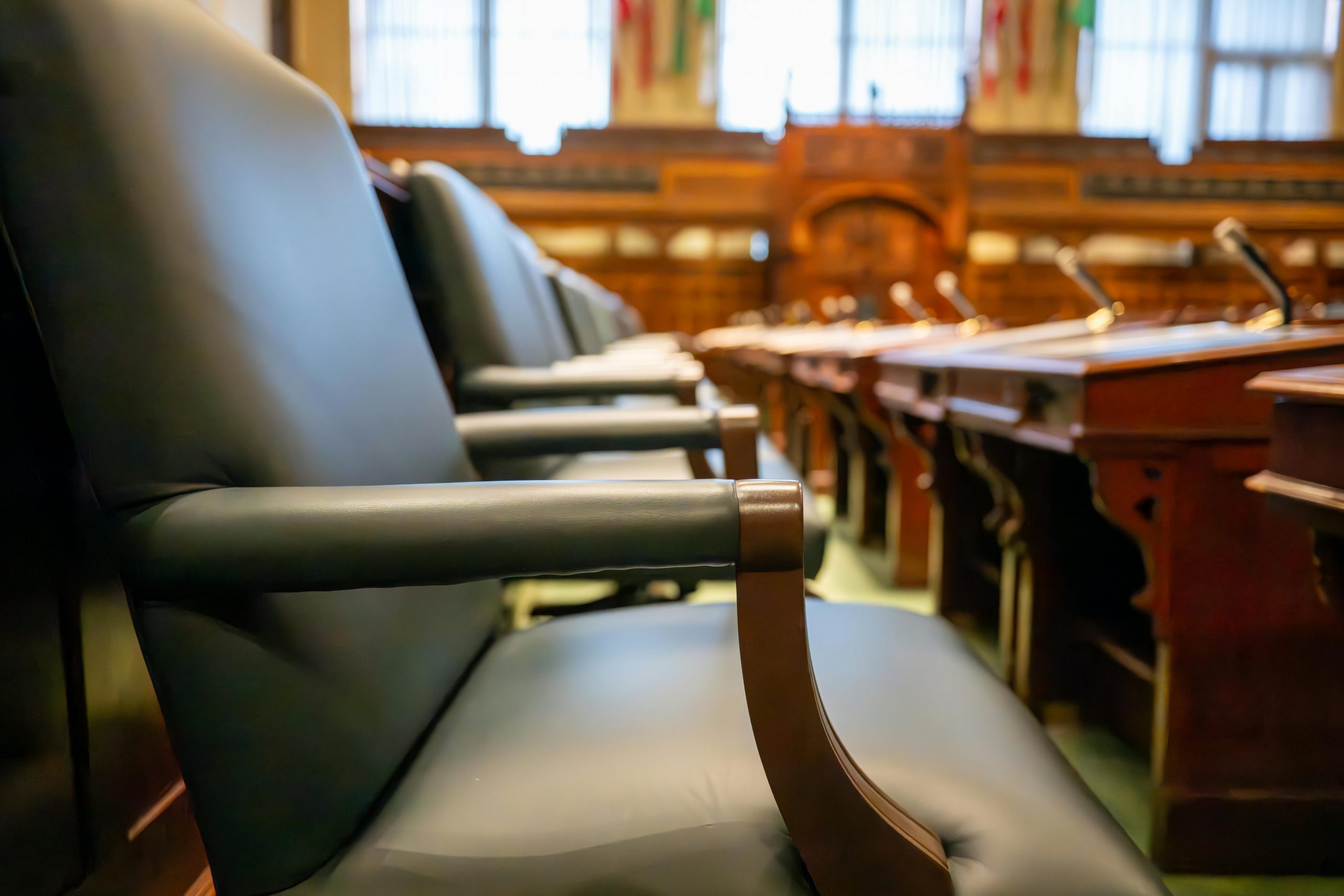 rows of empty seats in a courtroom